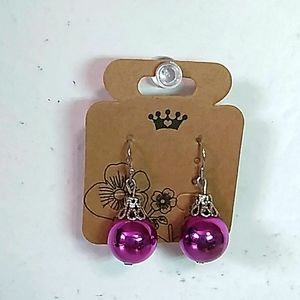 silver tone earrings with purple ornament beads